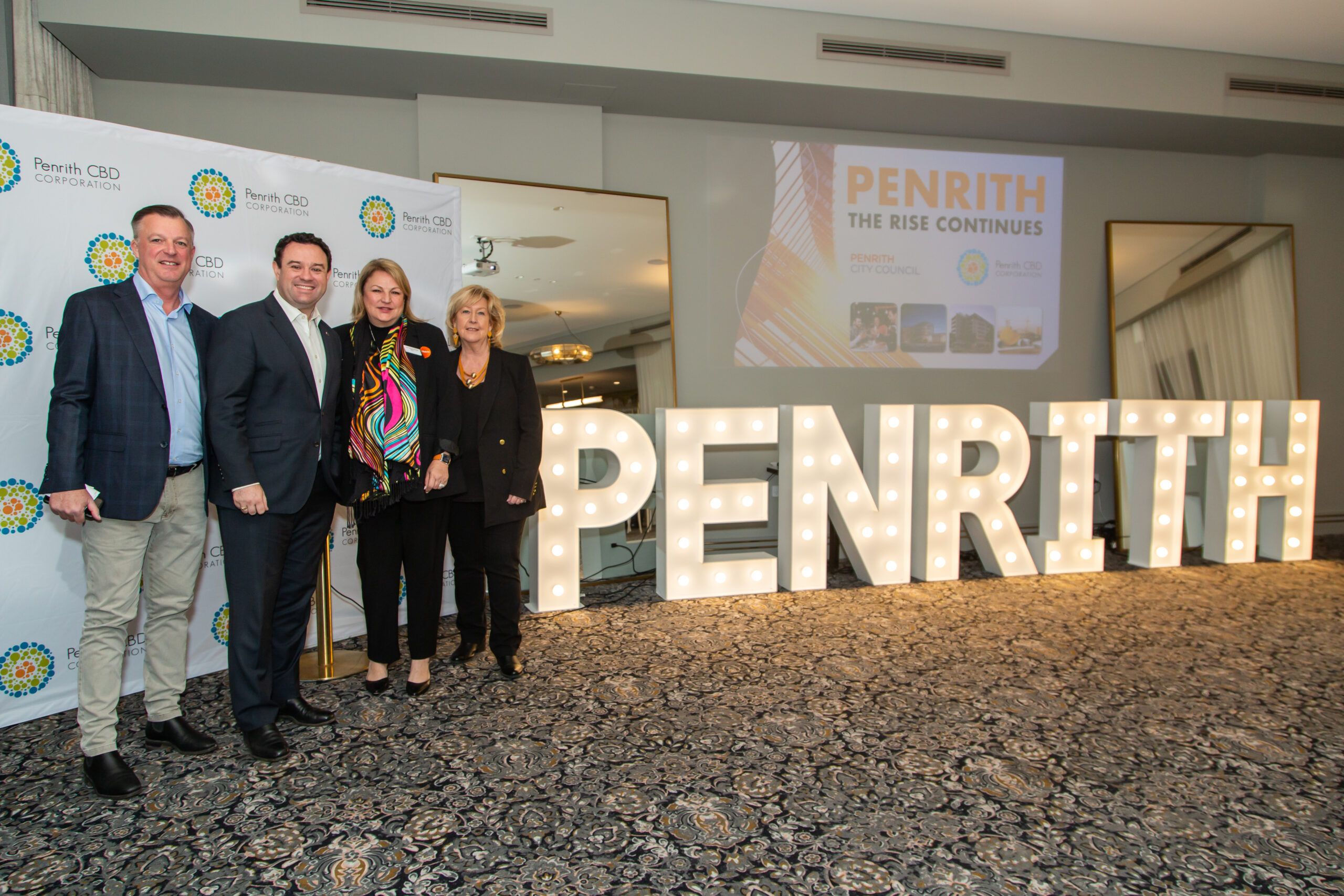 Darren Stuart Mayor Gai Penrith Sign and book cover on wall presentation